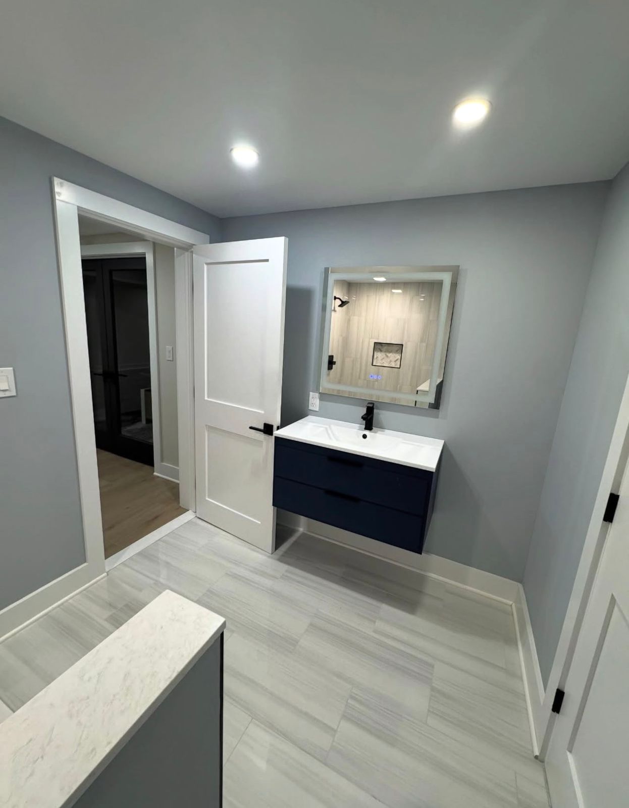 Floating vanity bathroom remodel in White Plains NY with minimalist design and increased floor space