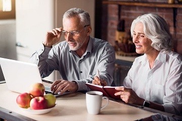 Older couple looking at a laptop together