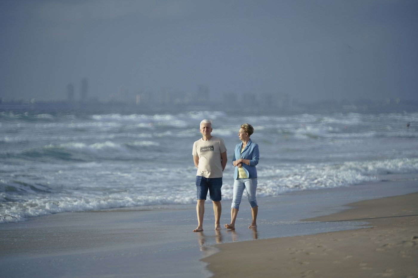Couple walking on the beach together