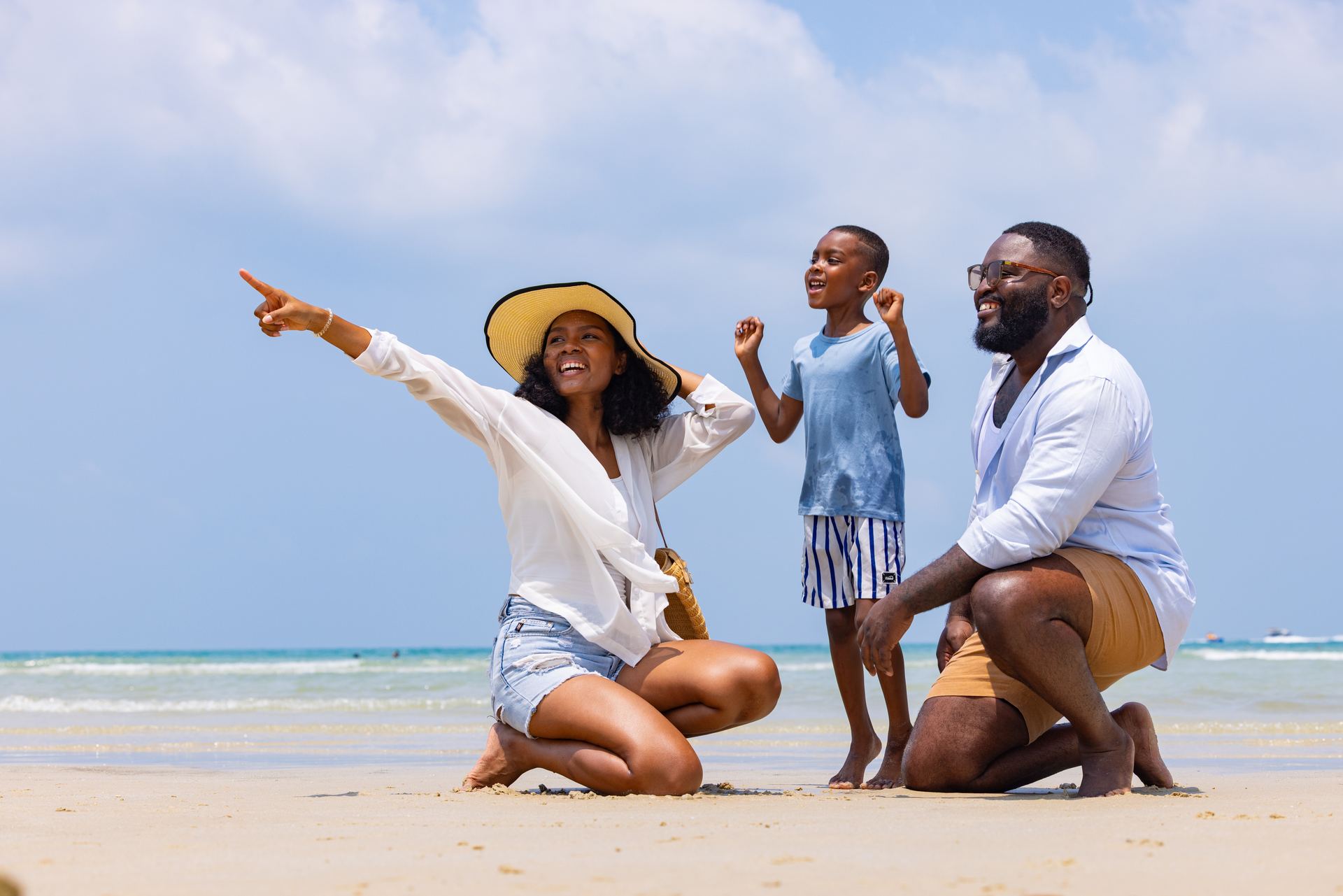Family playing together on the beach