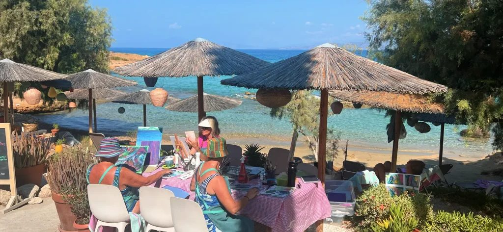 Aegina Island beach with art retreat guests painting