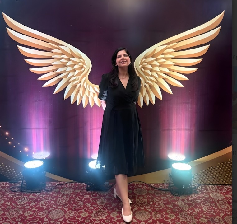 Speaker with Golden Wings Backdrop