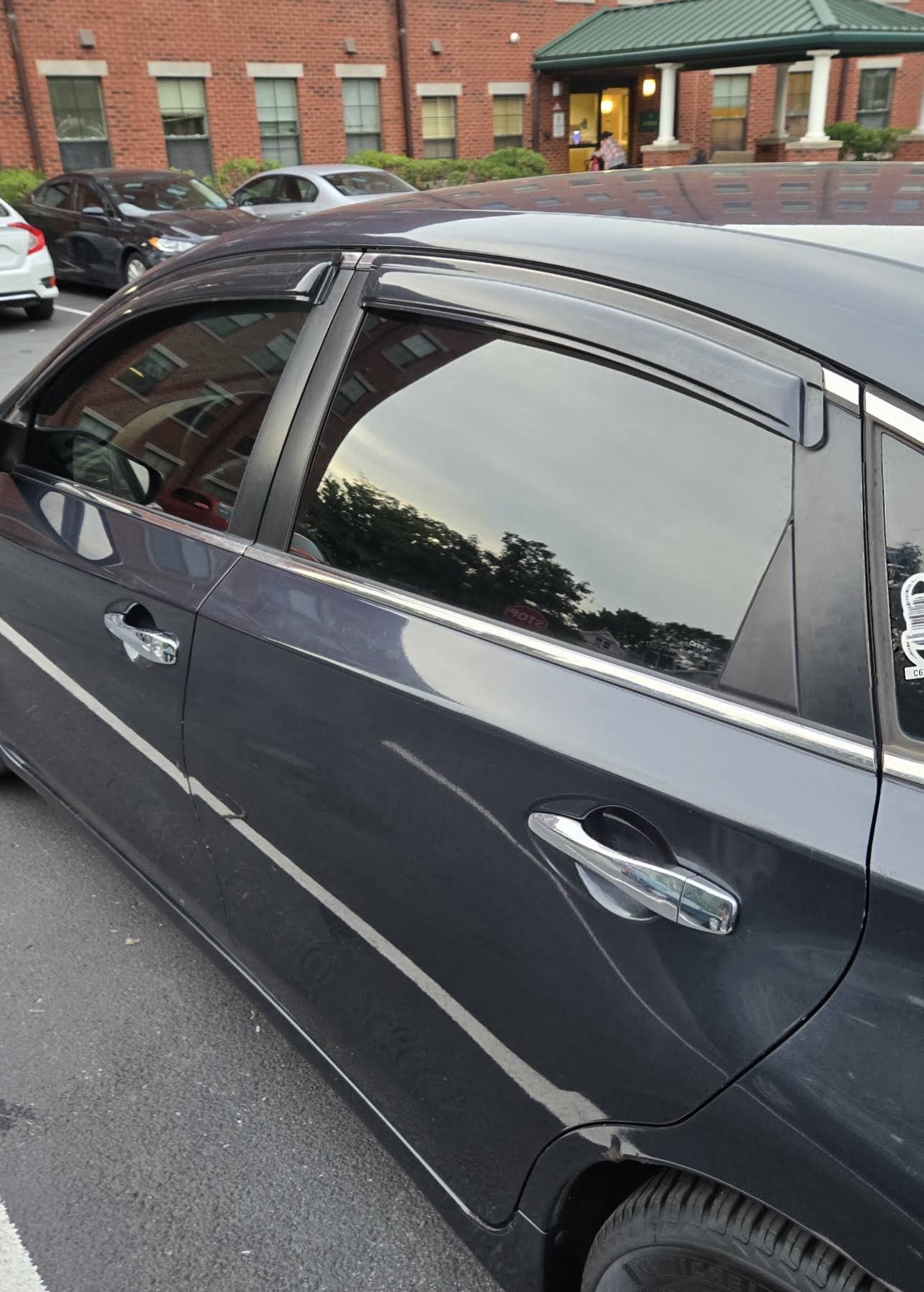 Close-up of tinted side windows on a dark sedan