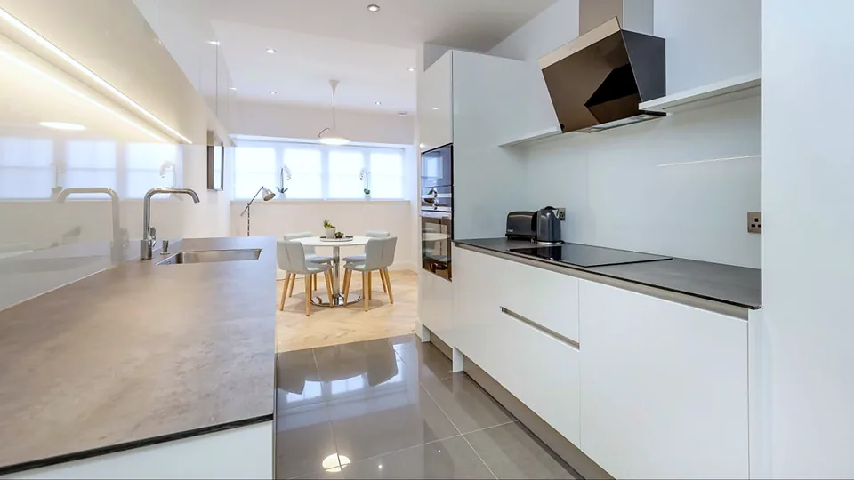 The fitted kitchen and dining area in the converted flat at Wemyss Mews.