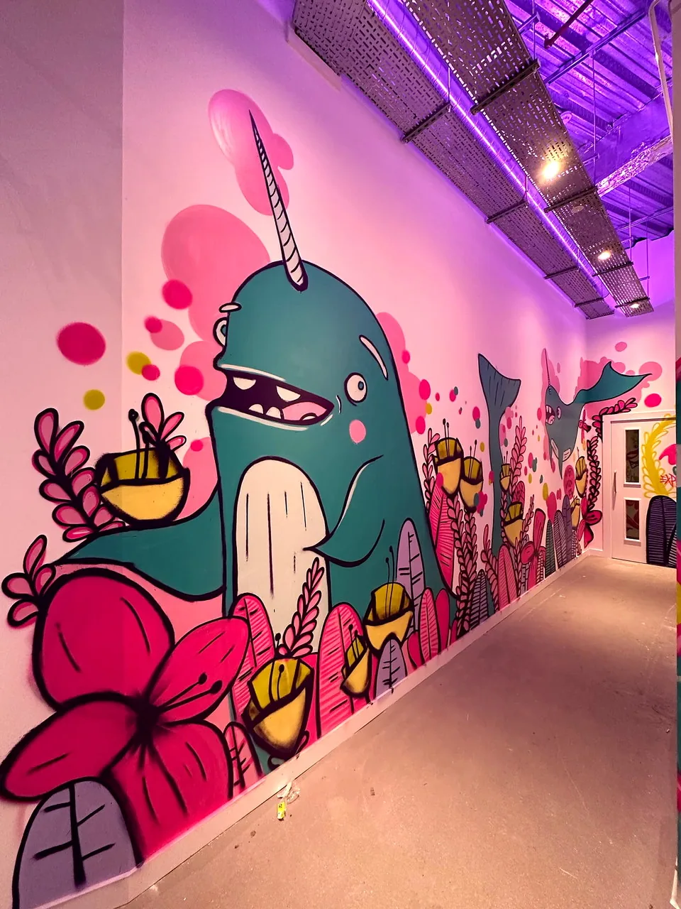 A painted mural running the length of the seating area at Edinburgh Street Food.