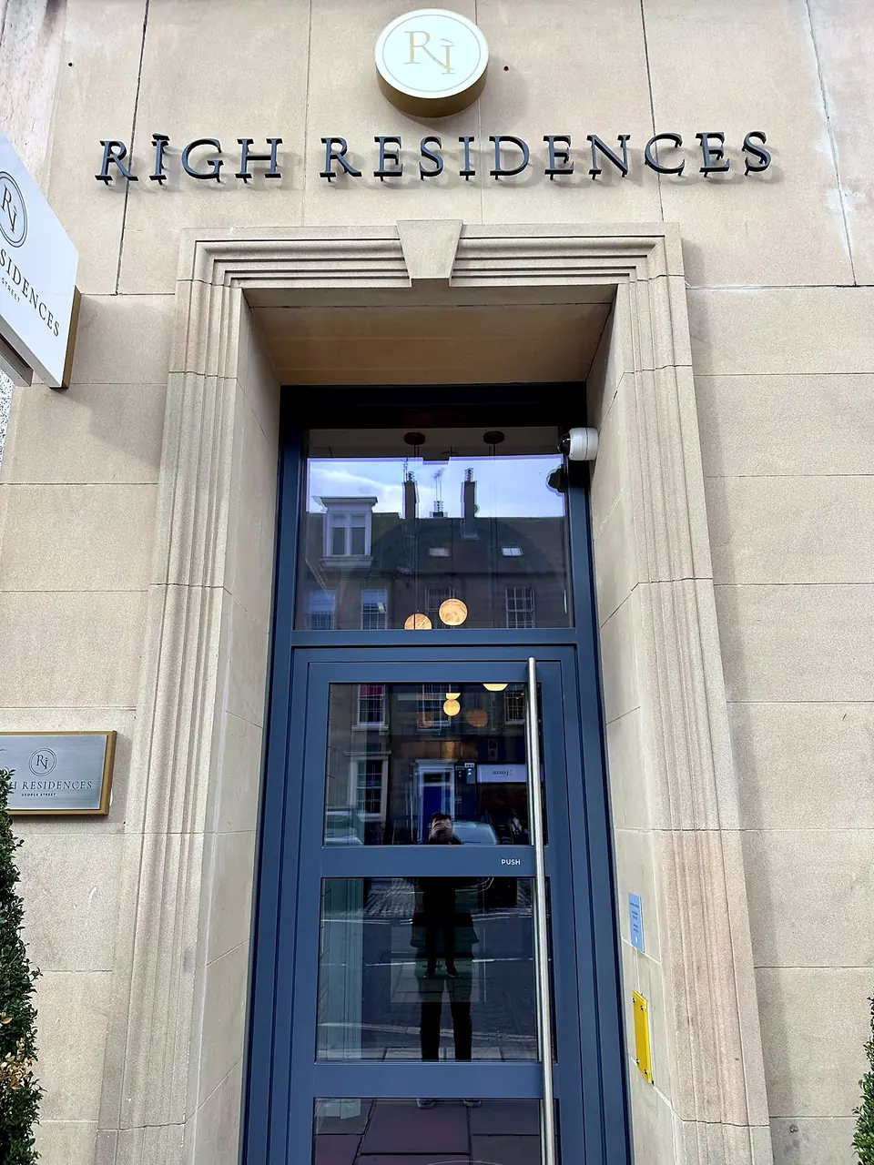 The stone entrance and signage at RIGH Residences, Edinburgh.