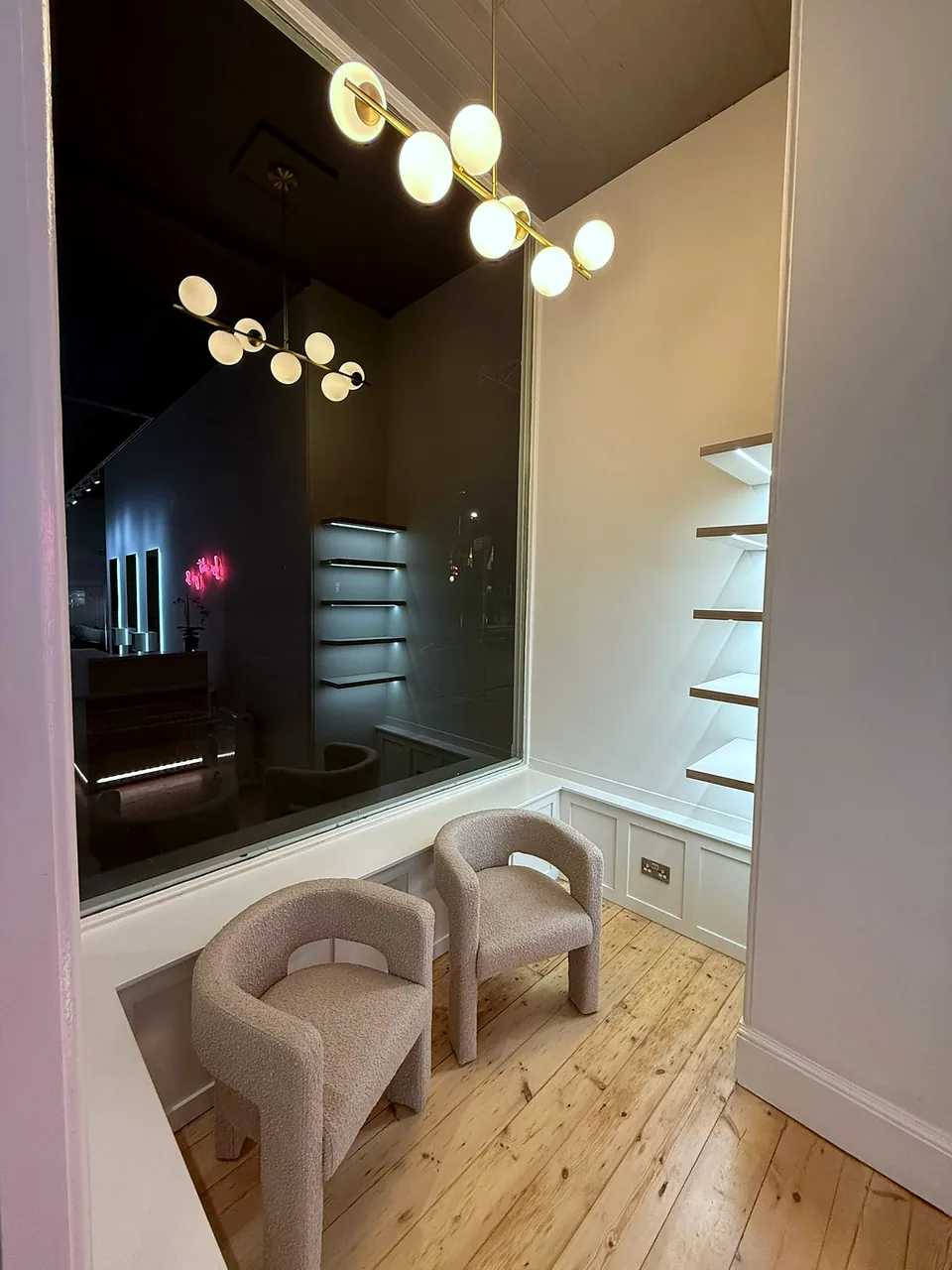 Fitted retail display shelving and seating at Calder & Calder, Edinburgh.