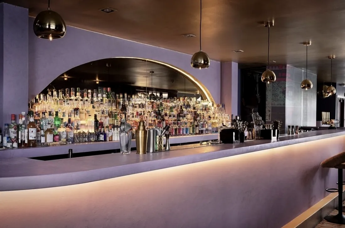 Banquette seating and terrazzo tables at The Cocktail Mafia, Edinburgh.