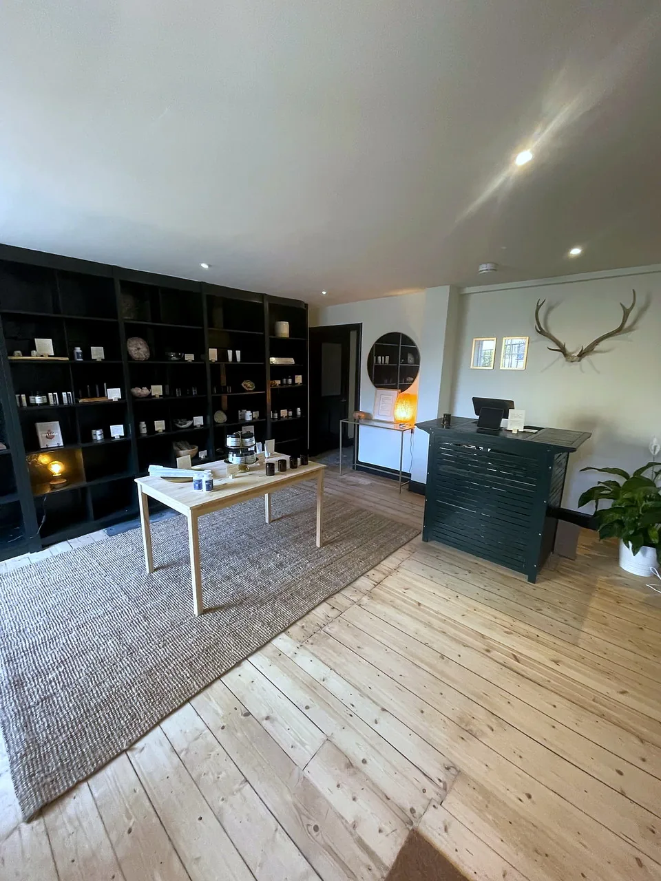 The retail floor at Solstice Wellness, with display shelving and a central table.