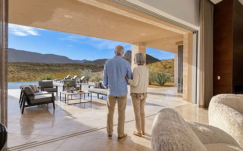 Homeowners taking in the desert and mountain views from their estate