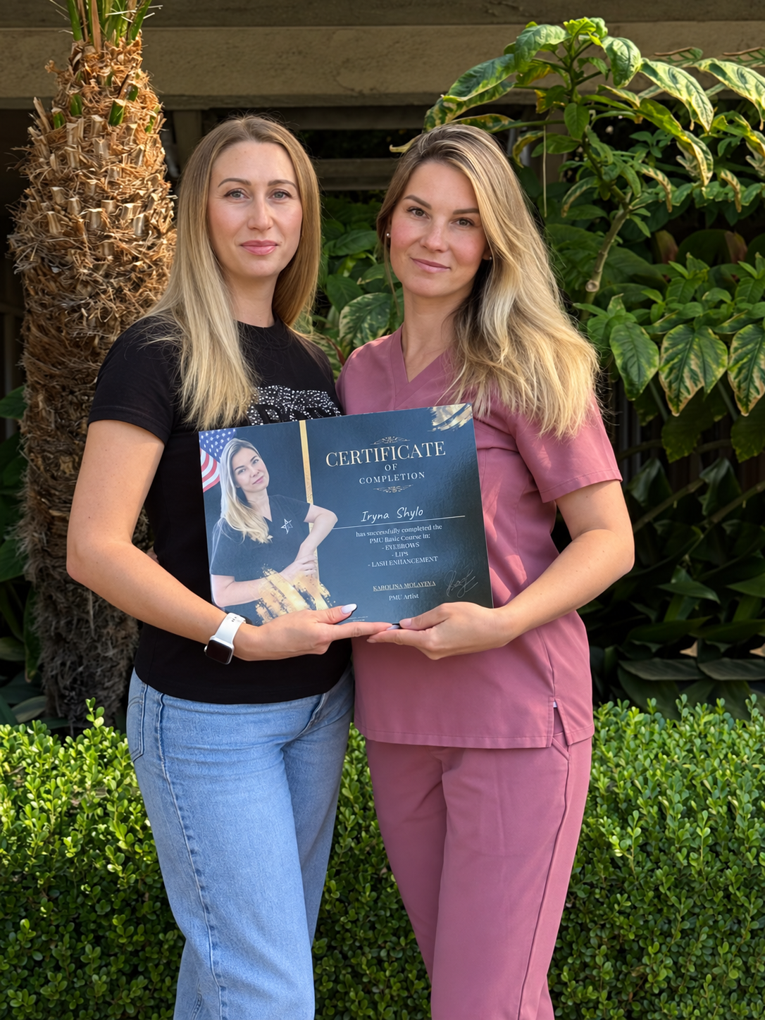 Iryna with her trainer and the PMU Basic Course certificate