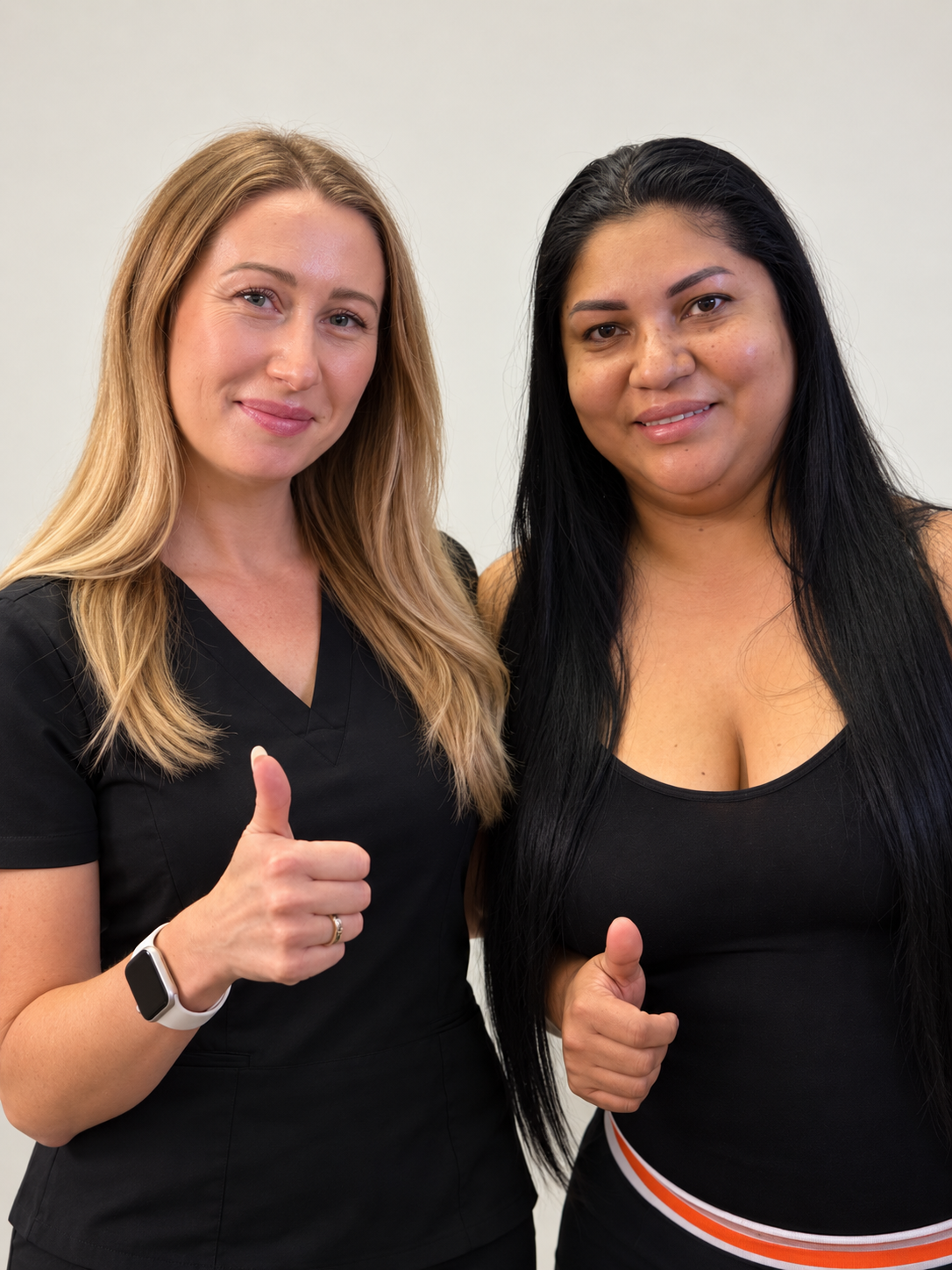 Iryna with a client giving a thumbs up