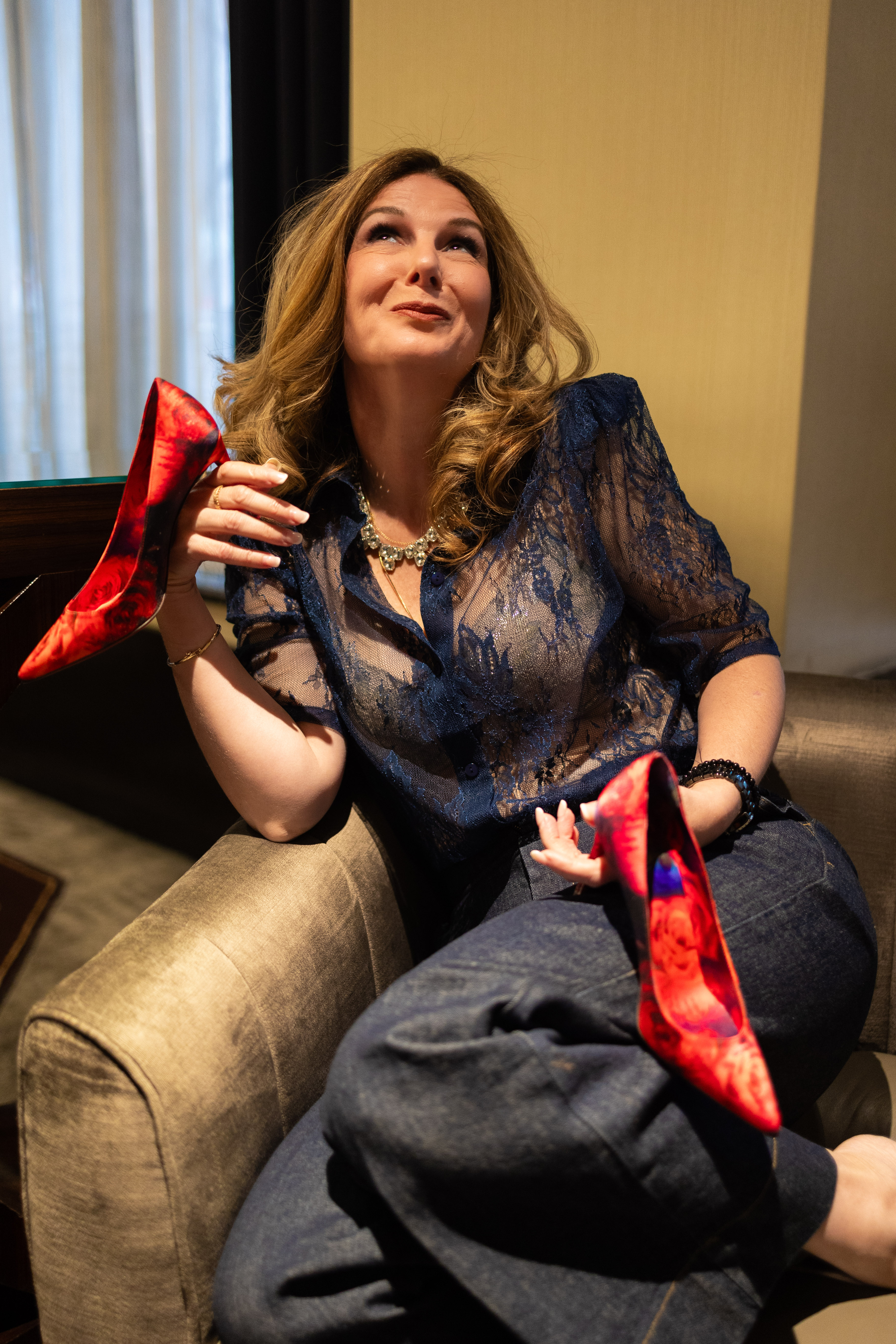 Suzana Mihajlovic holding shoes