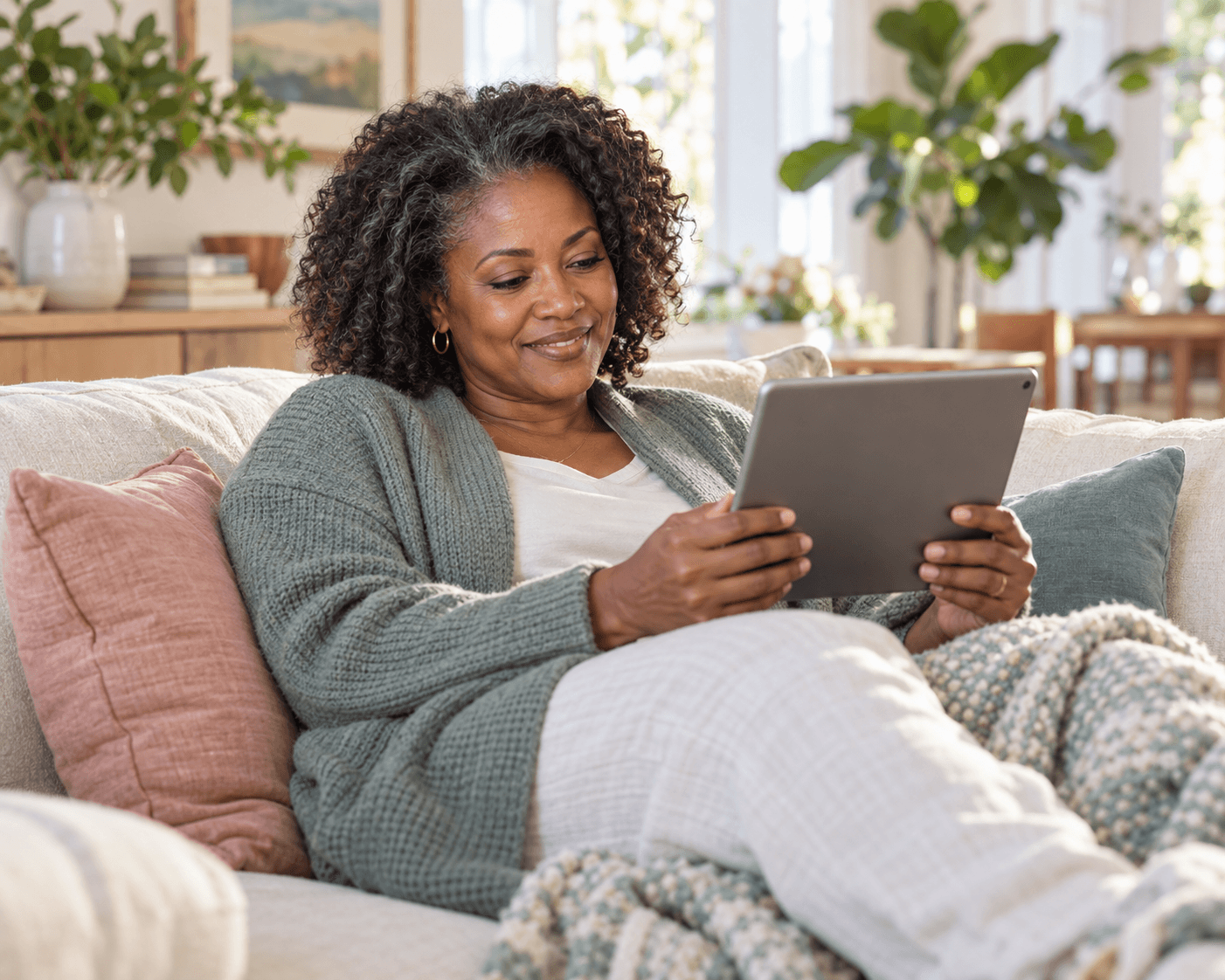 Woman on a telehealth visit from her sofa