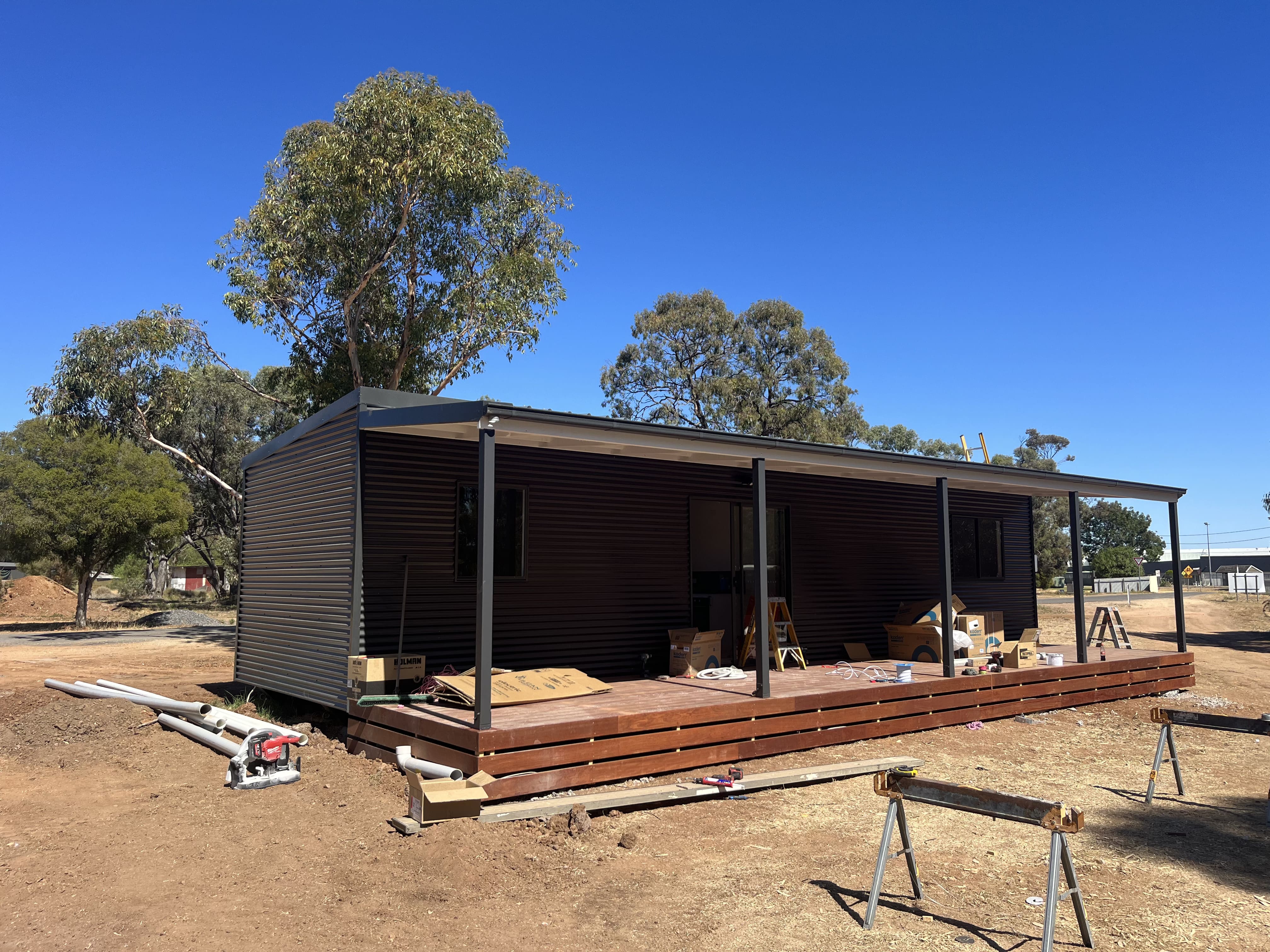 Modular home cladding and timber deck being finished on site in regional Victoria
