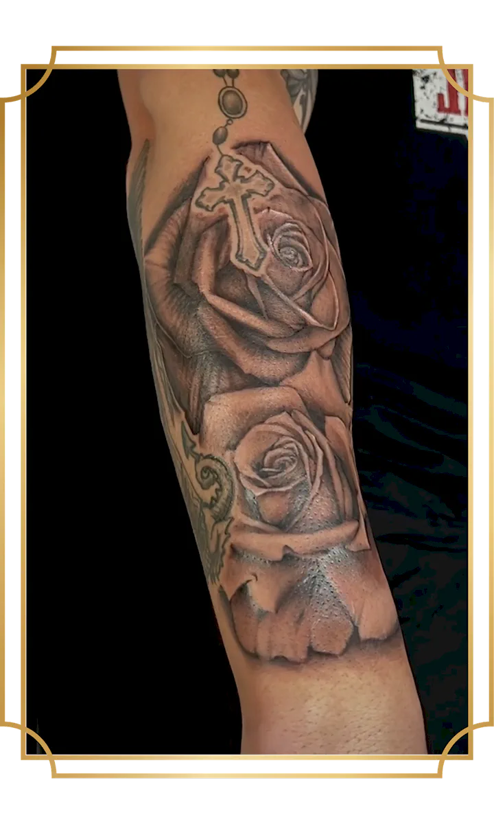 Black and gray two roses tattoo on the forearm