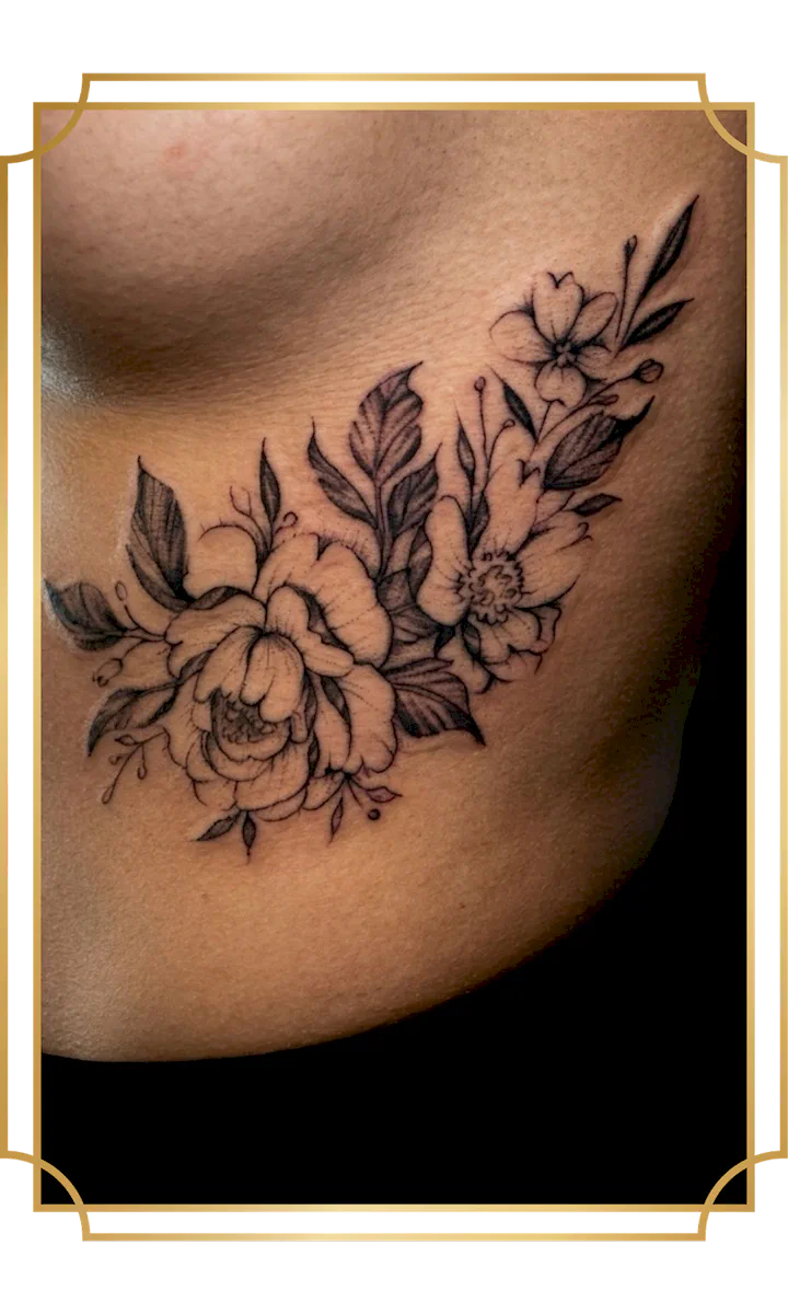 Floral fine-line rib tattoo by Alek the Saint, featuring a peony, open blossoms, detailed leaves and stipple shading flowing beneath the breast