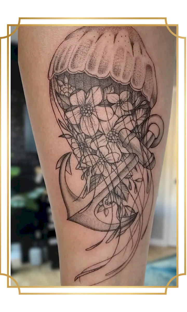 Illustrative fine-line jellyfish and anchor tattoo with flowers inside the bell, flowing tentacles and delicate dot shading, created in San Marcos