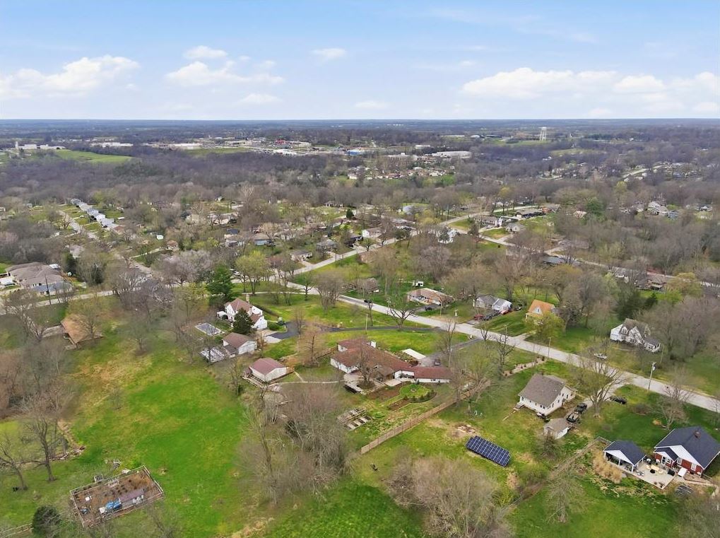 4 bedroom ranch home Excelsior Springs MO aerial view showing 1.43 acres with spacious lot and Kansas City suburb surroundings