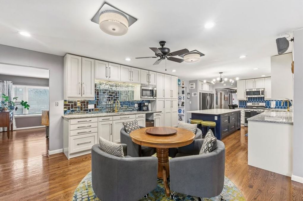 Updated kitchen in 4 bedroom ranch home Excelsior Springs MO with quartz countertops, custom cabinetry, center island and hardwood floors