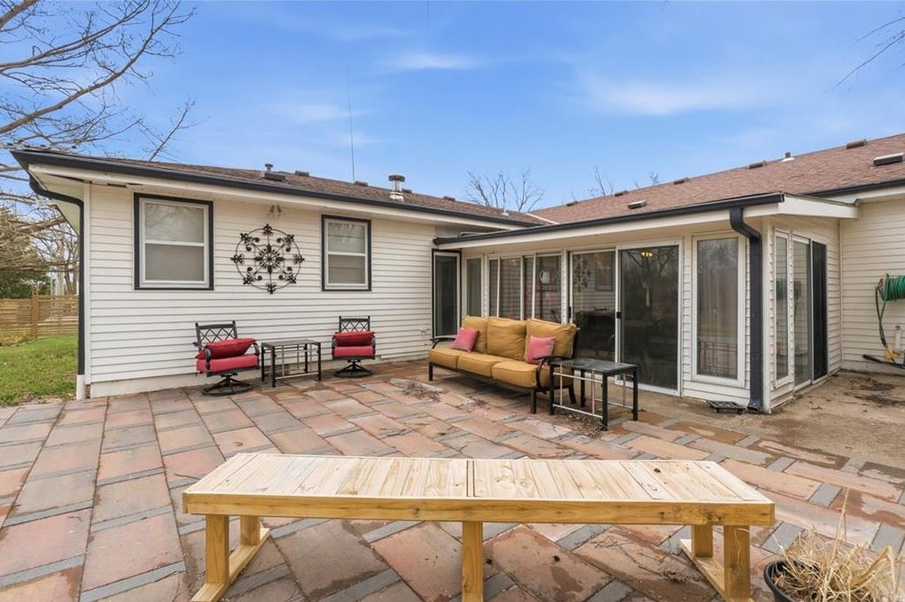 Outdoor patio and all-seasons room at updated ranch home Excelsior Springs MO with mid century modern character near Kansas City