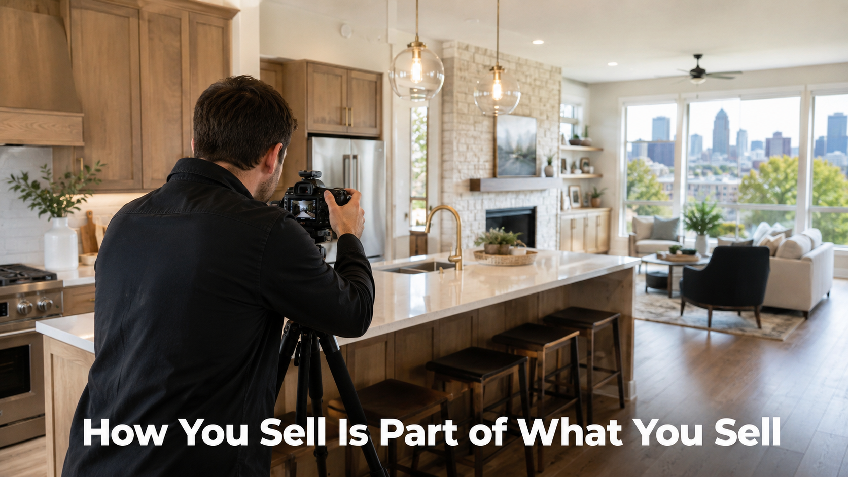 Photorealistic Kansas City home interior with a real estate photographer shooting a bright modern kitchen, quartz countertops, staged living room, city views, and headline text reading “How You Sell Is Part of What You Sell.