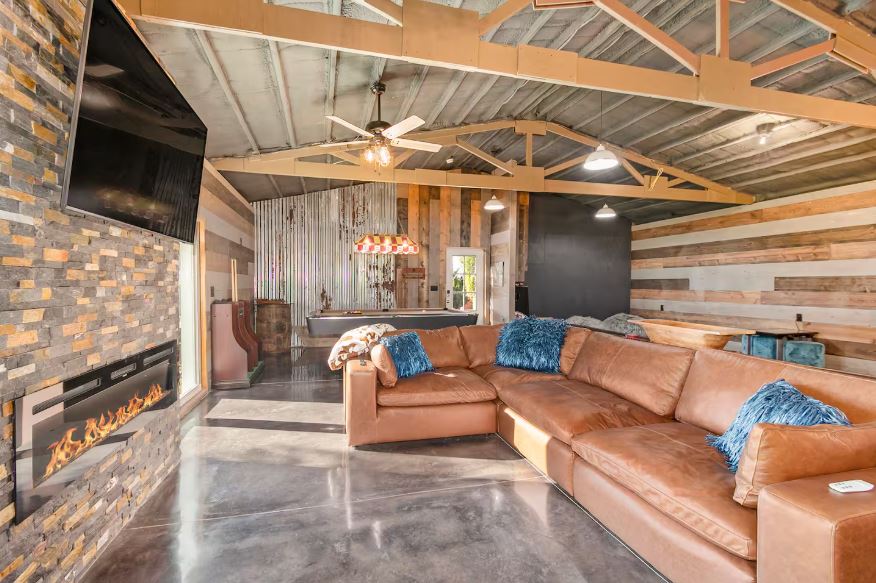 Spacious living area with large windows and natural light