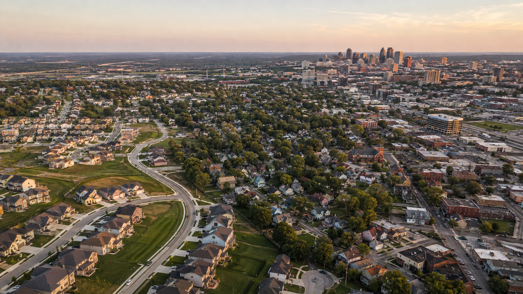 Aerial view of Kansas City metro neighborhoods featuring new Northland subdivisions, established suburbs, historic homes, and the downtown skyline. Aerial view of Kansas City metro neighborhoods featuring new Northland subdivisions, established suburbs, historic homes, and the downtown skyline.