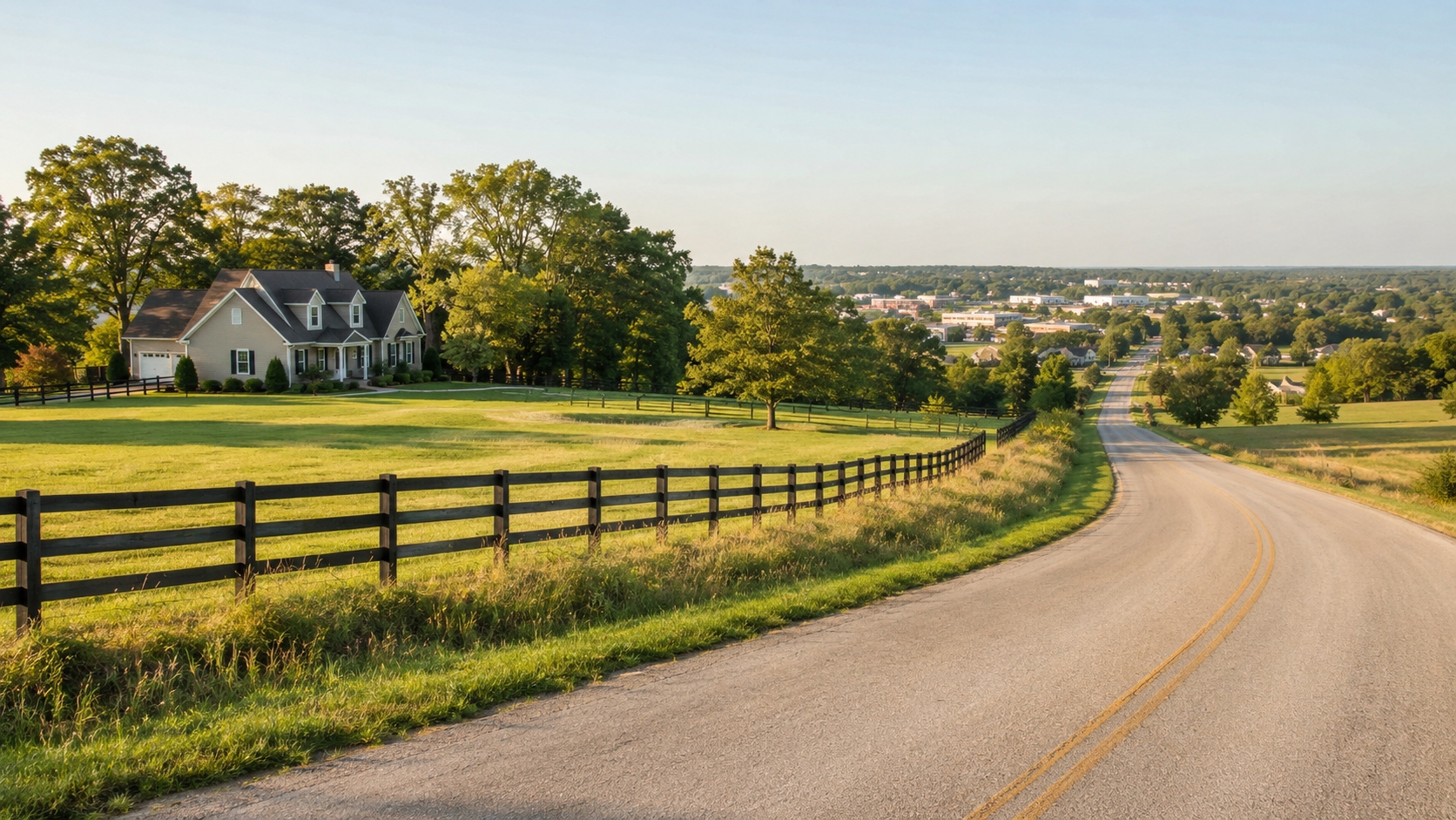 Acreage home and fenced meadow beside a quiet country road near shops and suburban neighborhoods in Lee’s Summit, Missouri.