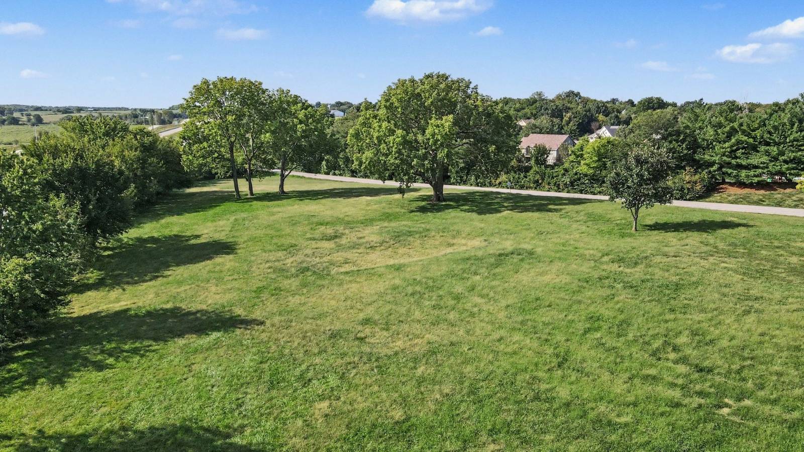 Open acreage with mature trees