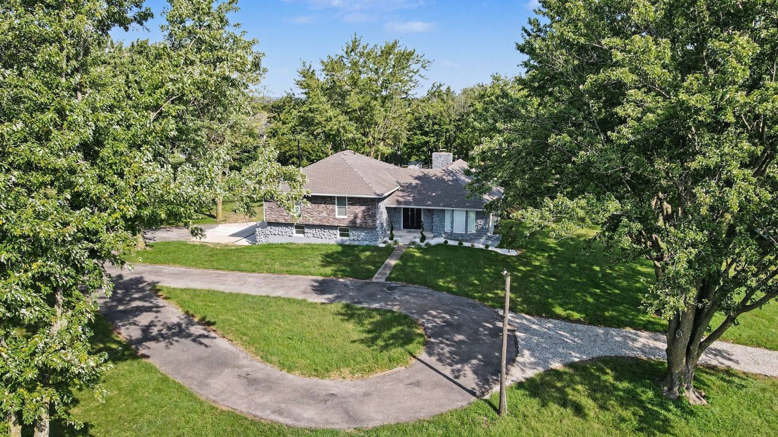Aerial view of home and circular drive