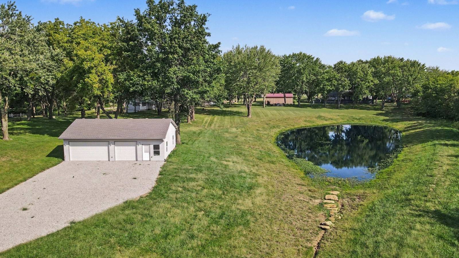 Aerial view of workshop pond and open acreage