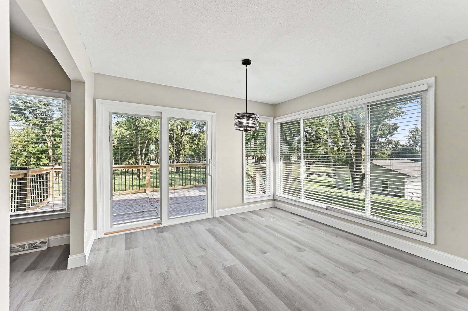 Sunlit dining area overlooking acreage