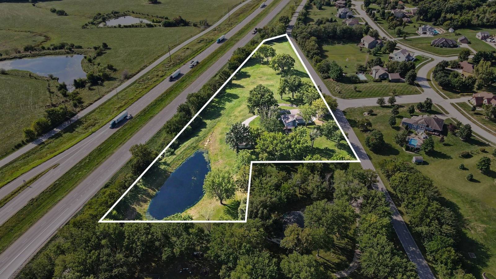 Aerial view of 6.02 acre property boundary