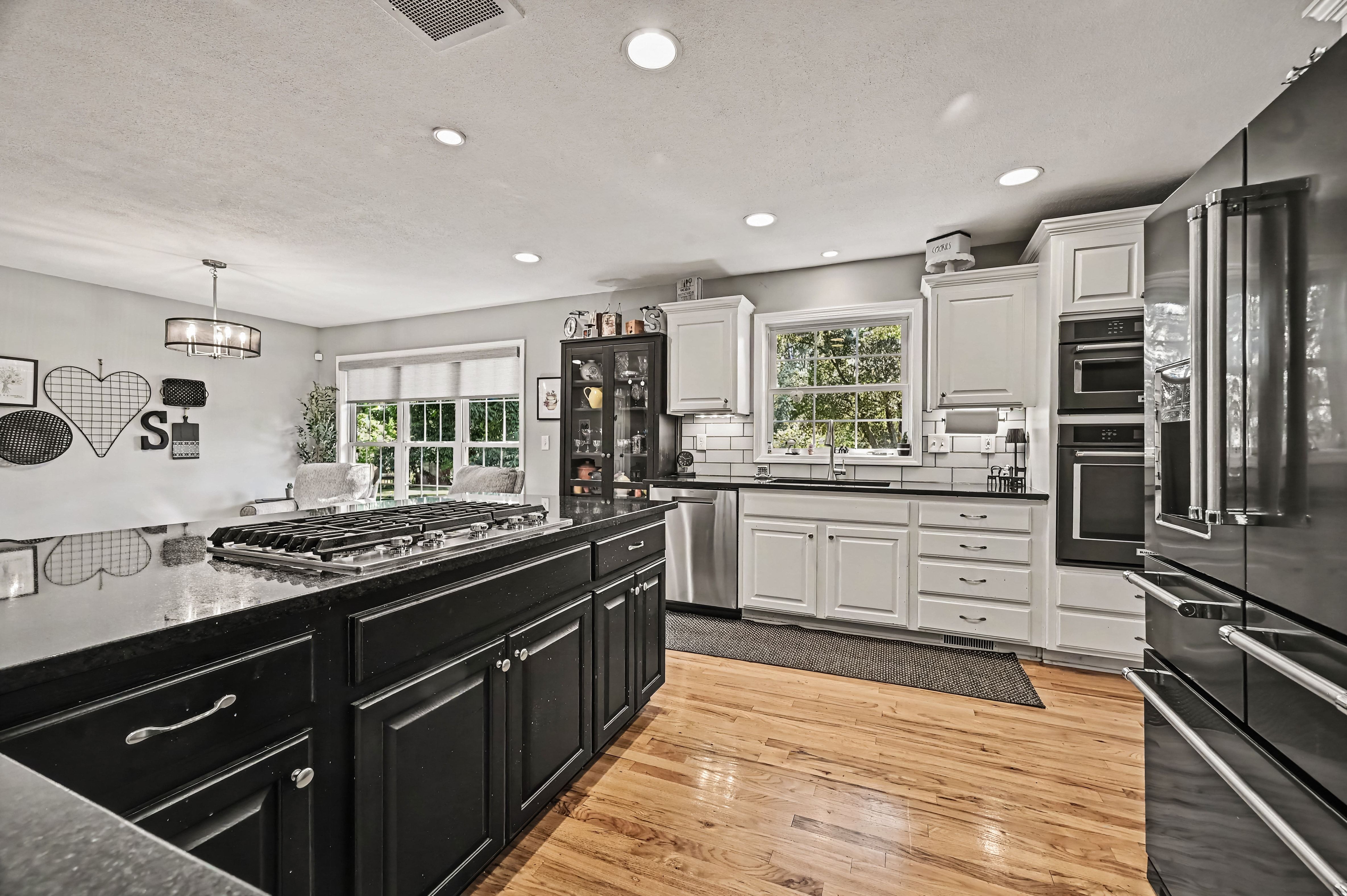 Kitchen island with granite counters and gas cooktop