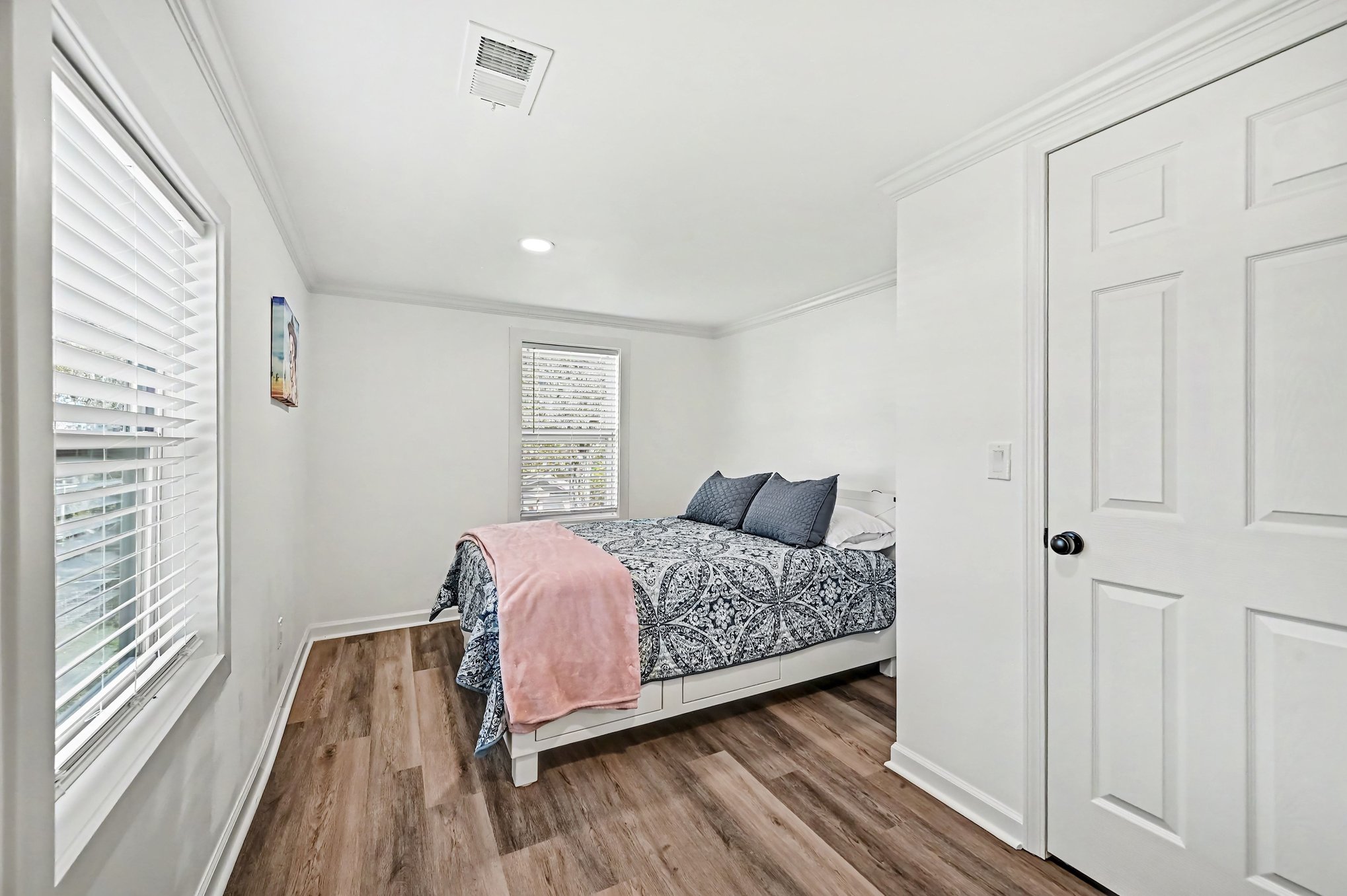 Bedroom with luggage rack and natural light