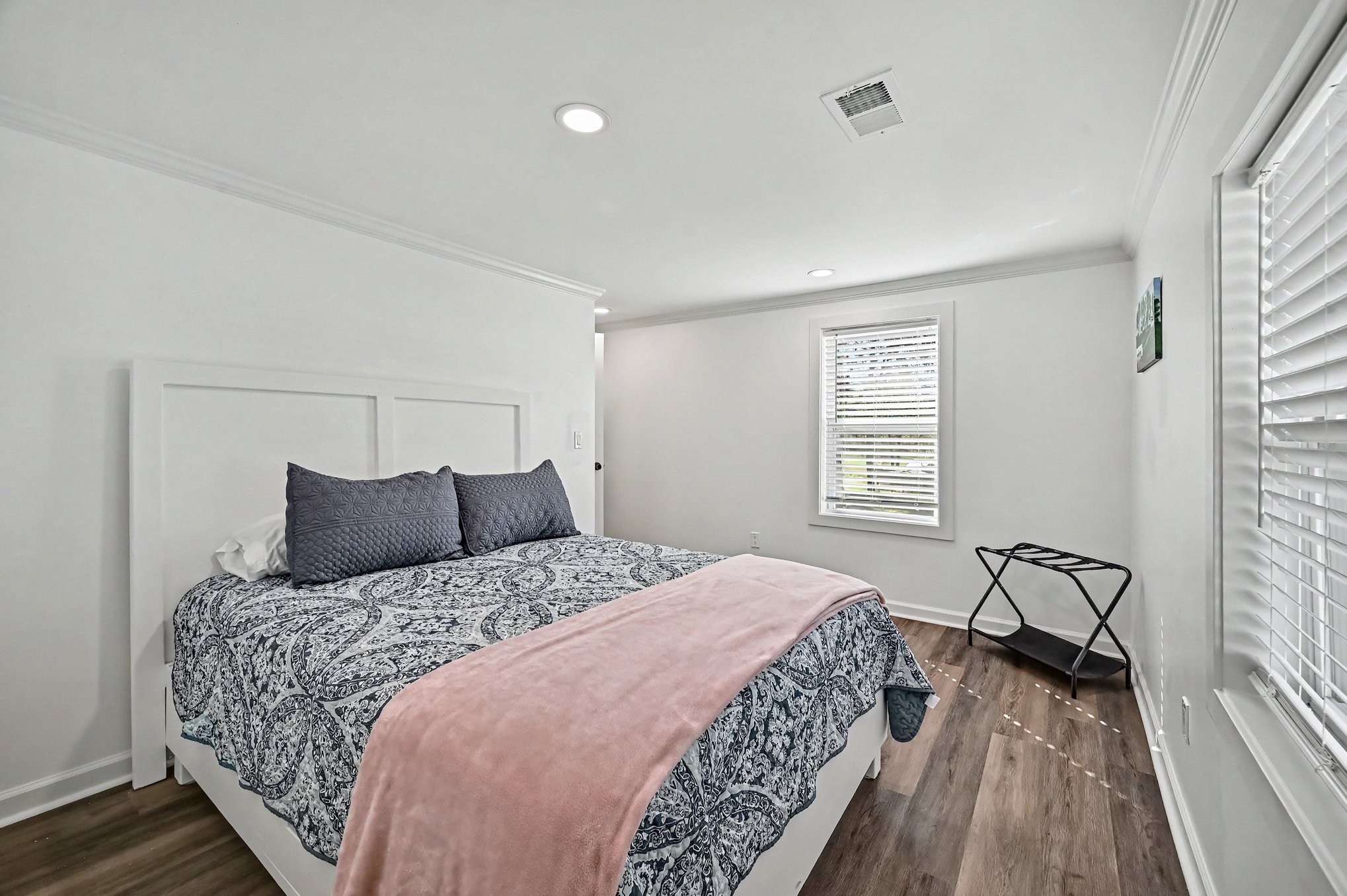 Bedroom with white panel headboard