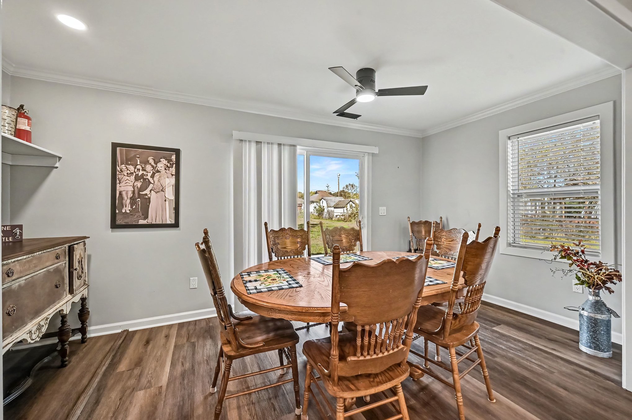 Dining room seating eight with sliding door to the yard