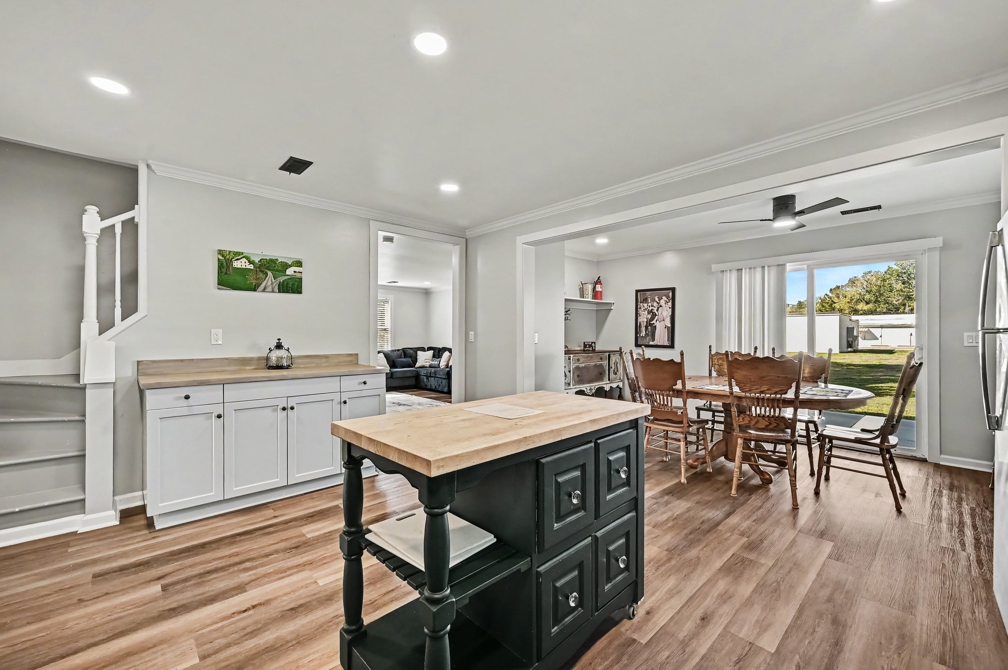 Kitchen island and built-in buffet, open to dining room and staircase