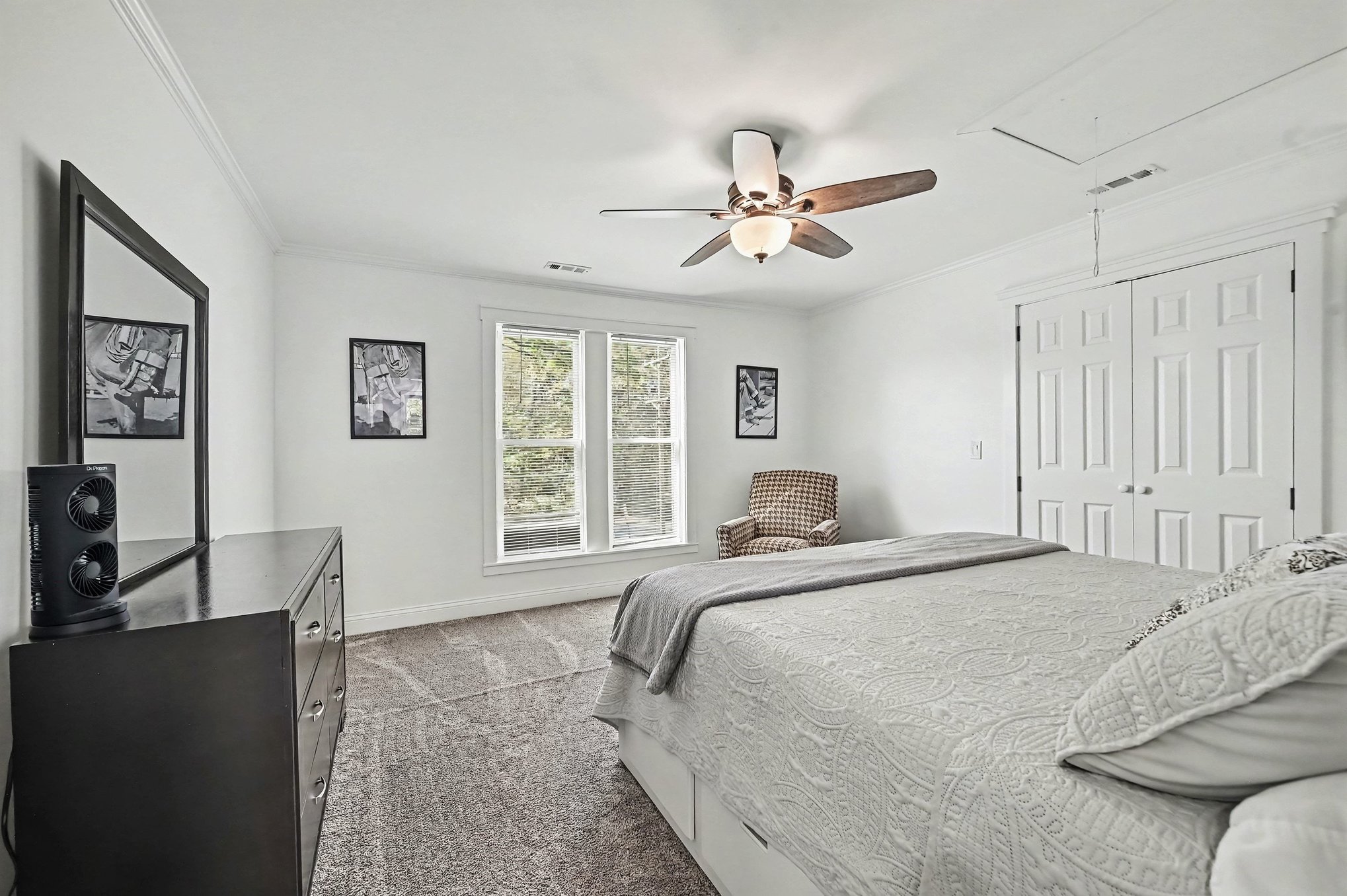 Upstairs bedroom with dresser and window seat light