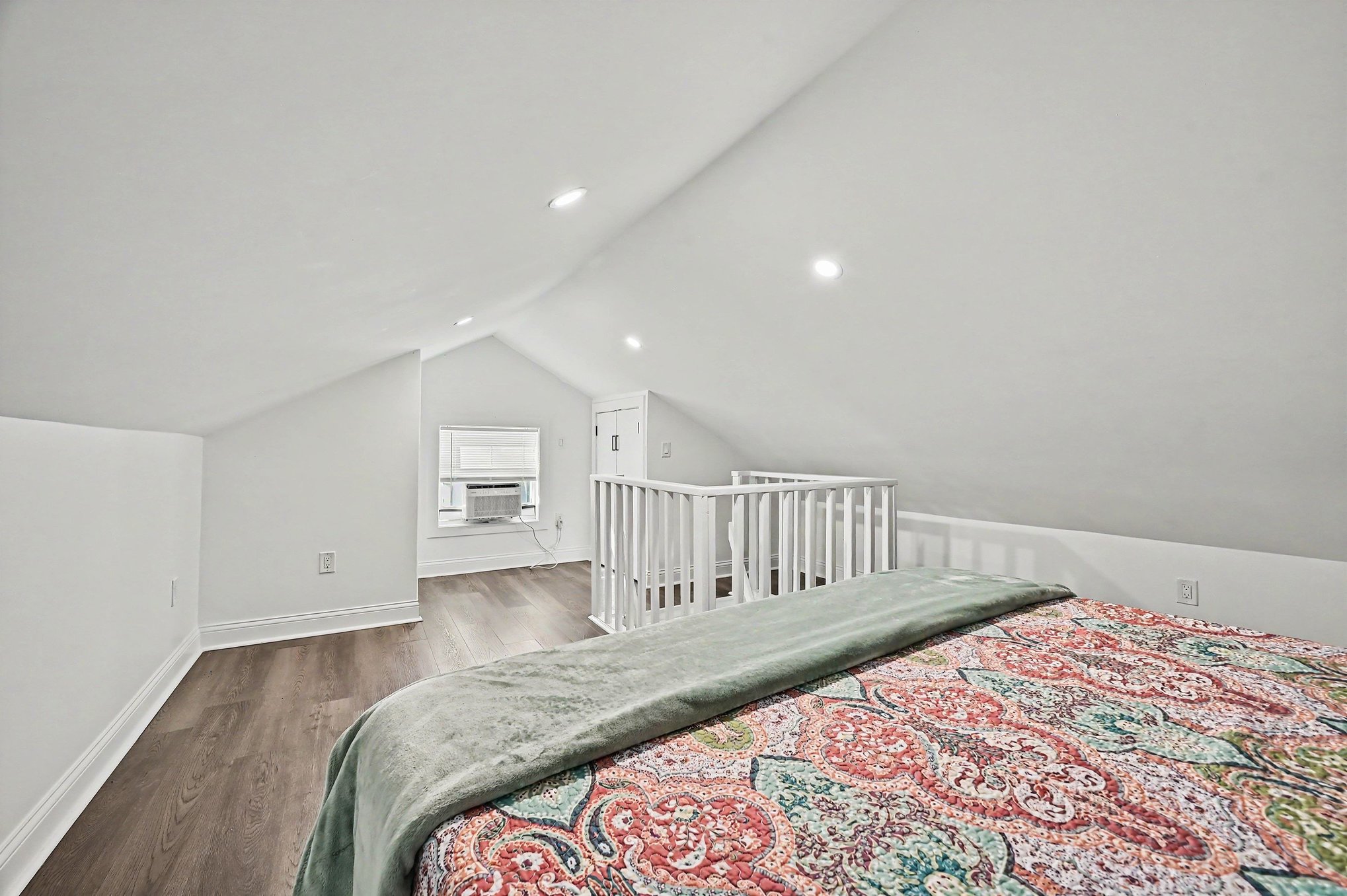Guest house vaulted loft bedroom