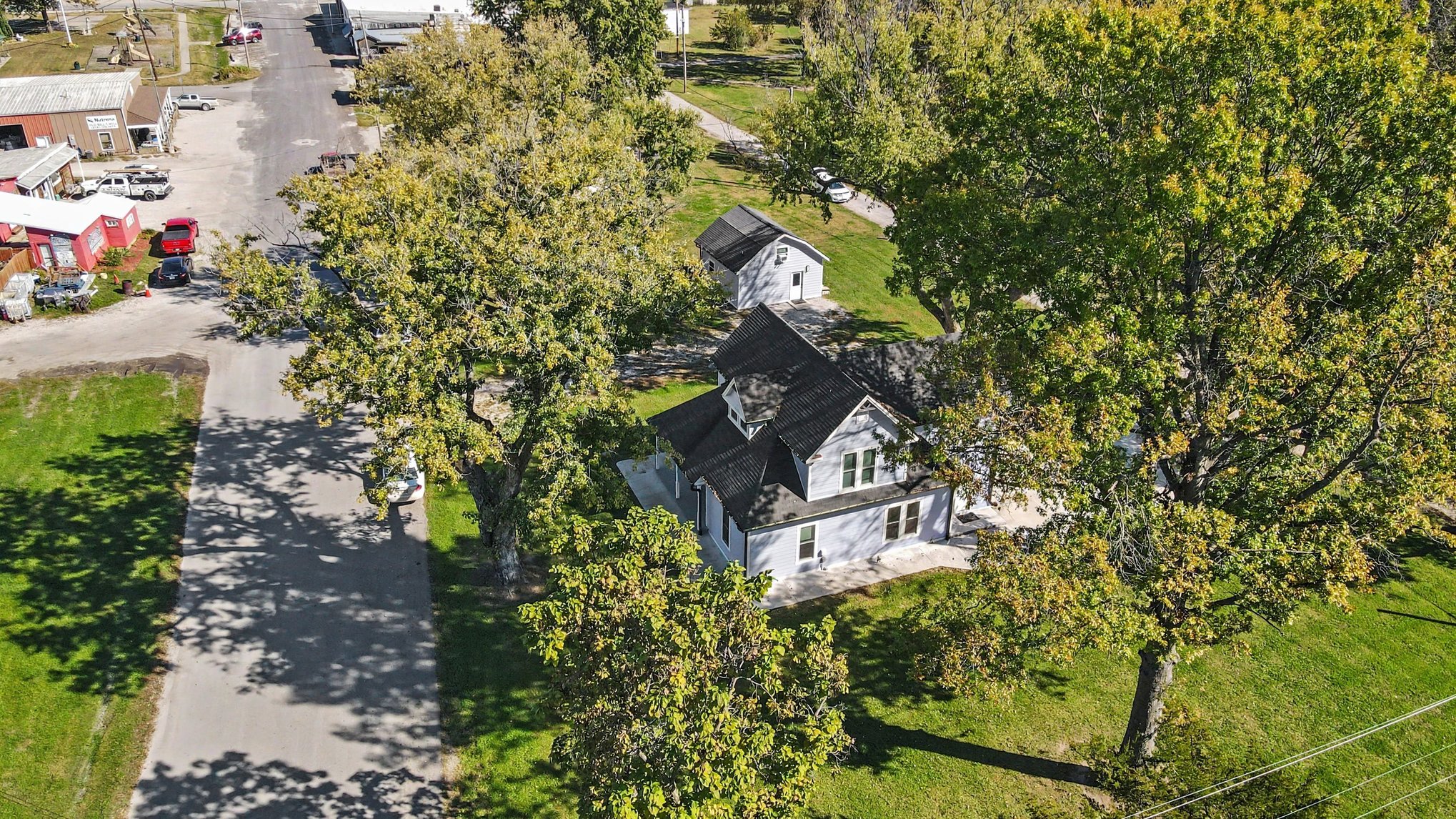Aerial along Main Street showing the home and guest house