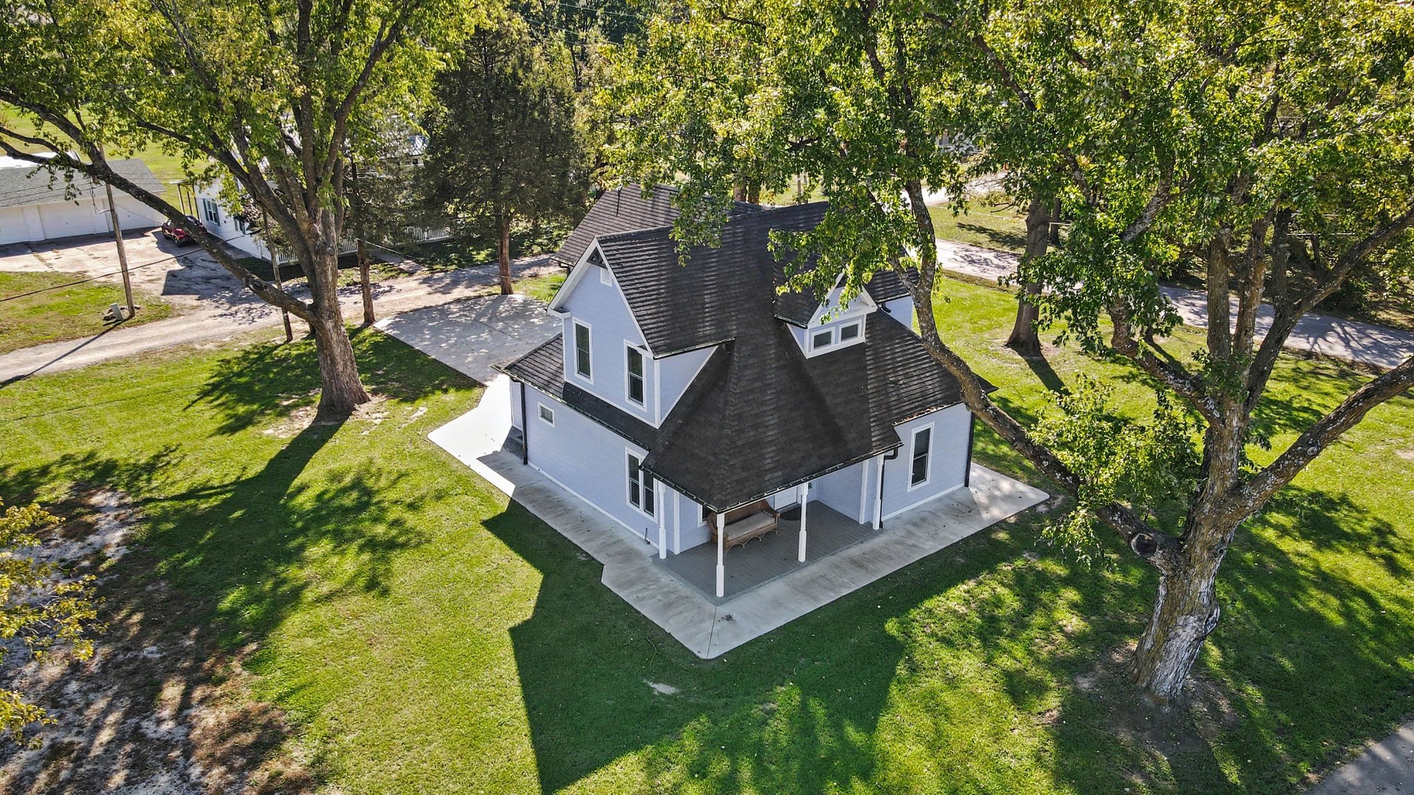 Aerial of the farmhouse porch and wraparound patio