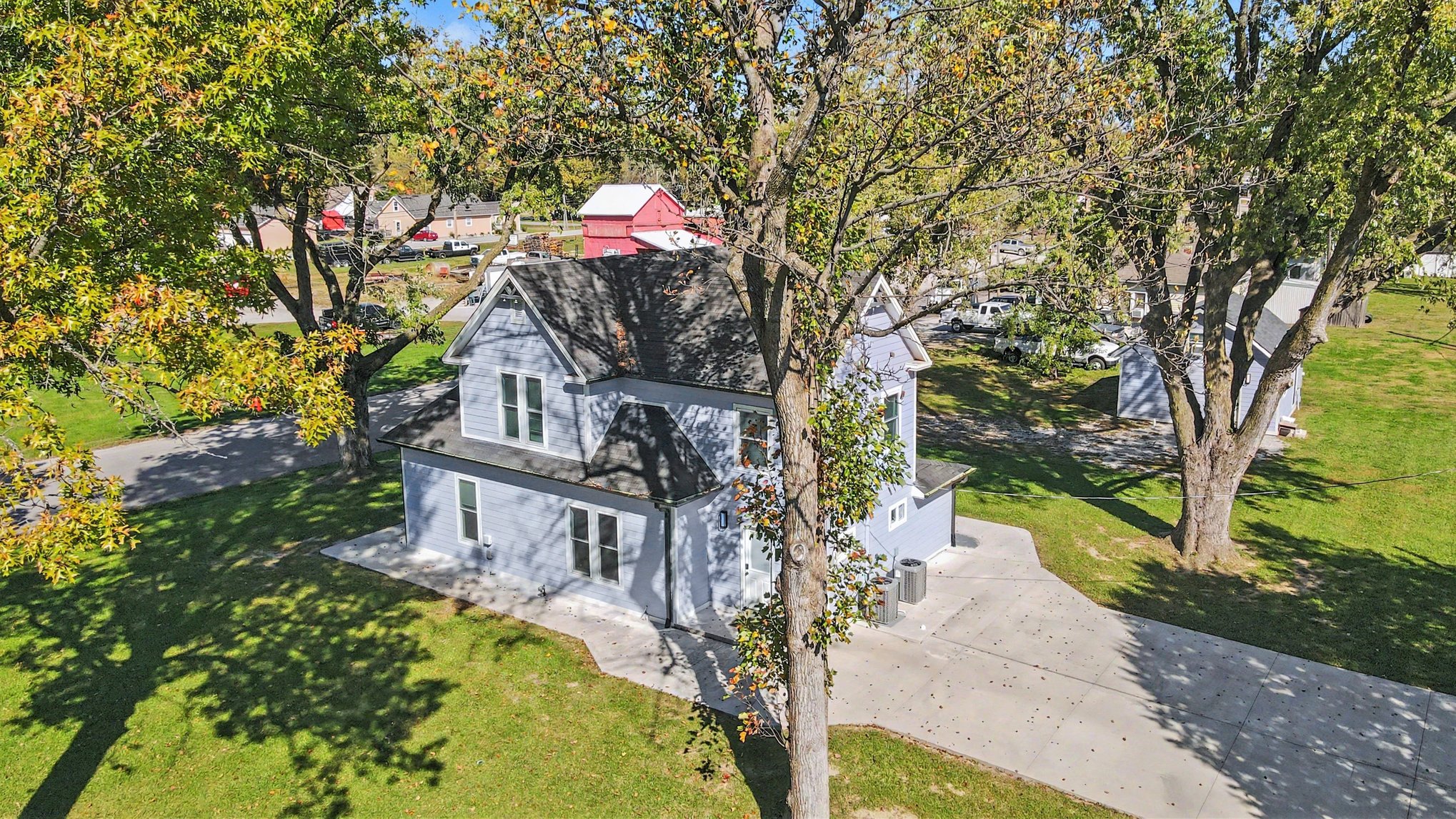 Aerial of the farmhouse with Holt Main Street beyond