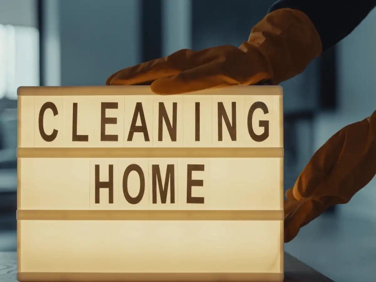 alt="Illuminated 'Cleaning Home' sign representing the professional residential cleaning service offered by Crisp Clean Home in Maryland."