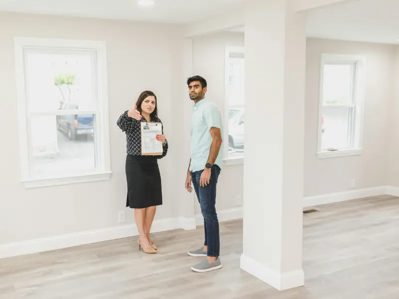 alt="A Realtor showcasing a market-ready home in Maryland after a complete REO and foreclosure cleaning service."