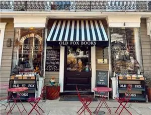 alt="The charming storefront of Old Fox Books & Coffeehouse, a beloved independent bookstore in Annapolis, MD."
