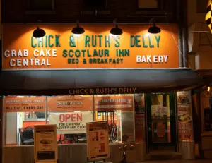 alt="The iconic storefront of Chick & Ruth's Delly, a historic and beloved restaurant on Main Street in Annapolis, MD."