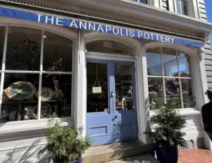 alt="The storefront of Annapolis Pottery, a local artisan shop known for its handmade pottery and unique gifts."