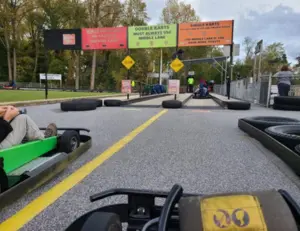 alt="Go-karts racing on the outdoor track at Crofton Go-Kart Raceway, a fun family attraction in Crofton, MD."